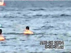 Sassy couple voyeured in the water seems to be fucking