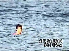 Sassy couple voyeured in the water seems to be fucking