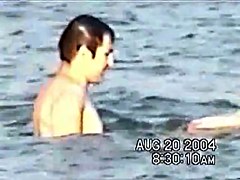 Sassy couple voyeured in the water seems to be fucking