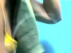 Amateur in beach cabin exposes nice tits and beaver