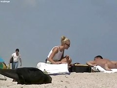 Sexy blondie relaxing on the nudist beach while I.m spying with my cam