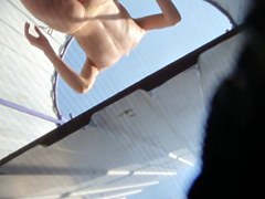 Beach cabin voyeur video with the naked teen spied