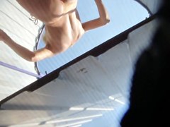 Beach cabin voyeur video with the naked teen spied