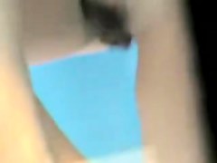 Dark nippled tits were voyeured in the beach cabin
