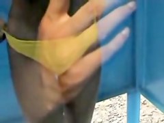 Dark nippled tits were voyeured in the beach cabin
