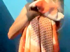 Girls from the beach show pussies and tits in beach cabin