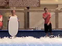 Sexy flowrider is demonstrating her downblouse in aqua park