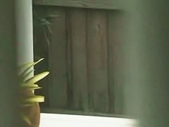 Gorgeous blonde with juicy tits swims completely naked in the pool by the beach