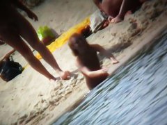 Nude beach spy camera films flat chest girl with hairy bush