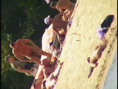 Smooth ass babes on the beach are showing their boobies