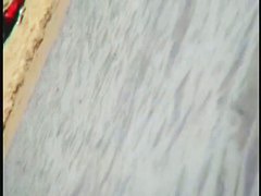 Smooth ass babes on the beach are showing their boobies