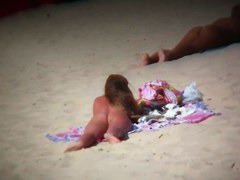 Aluring beach video of nudists enjoying the warm sun