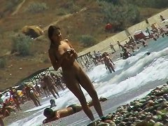 Voyeur video of nude girls having fun on a nudist beach