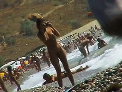 Voyeur video of nude girls having fun on a nudist beach