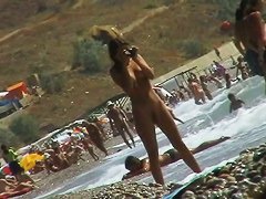 Voyeur video of nude girls having fun on a nudist beach