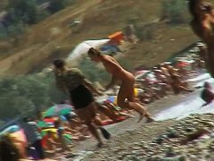 Voyeur video of nude girls having fun on a nudist beach