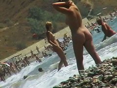 Voyeur video of nude girls having fun on a nudist beach
