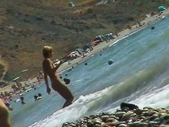 Voyeur video of nude girls having fun on a nudist beach