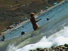 Voyeur video of nude girls having fun on a nudist beach