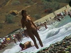 Voyeur video of nude girls having fun on a nudist beach