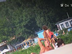 Stunning nude female body caught on a beach voyeur video