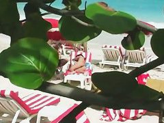Various females on the beach tanning in a porno compilation