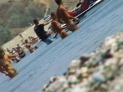 lots of very sexy naked babes on the nudist beach getting wet