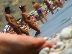 lots of very sexy naked babes on the nudist beach getting wet