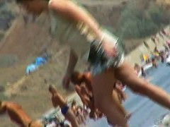 lots of very sexy naked babes on the nudist beach getting wet