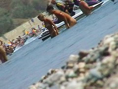 lots of very sexy naked babes on the nudist beach getting wet