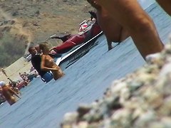 lots of very sexy naked babes on the nudist beach getting wet