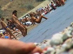 lots of very sexy naked babes on the nudist beach getting wet