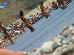 lots of very sexy naked babes on the nudist beach getting wet