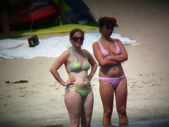 Nude beach voyeur spies on a perky breasted blonde