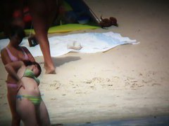 Nude beach voyeur spies on a perky breasted blonde