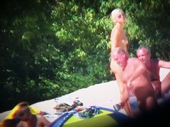 Hot naked babes exposing their pussy at the beach