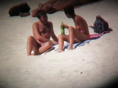 Hot naked babes exposing their pussy at the beach