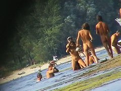 Nude beach spy camera with a sexy couple in focus