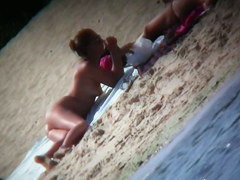 My girlfriends are playing on the beach while I film them