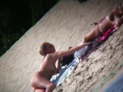 My girlfriends are playing on the beach while I film them