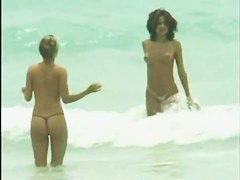 Hot nude woman having fun on a hot beach video