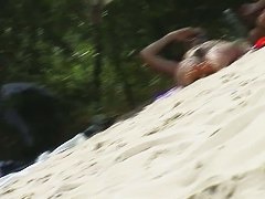 A nudist beach video with big dome tits and hairy pussies