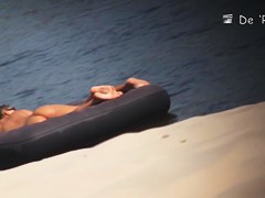 Two naked girls get their cute butts on beach voyeur camera