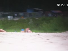 Two naked girls get their cute butts on beach voyeur camera
