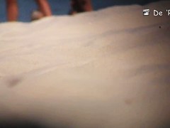 Two naked girls get their cute butts on beach voyeur camera