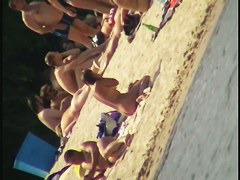 Nude beach voyeur film making extravaganza with hoes on the phone