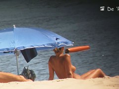 Voyeur webcam catches amateurs nude and half nude on beach