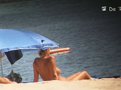 Voyeur webcam catches amateurs nude and half nude on beach