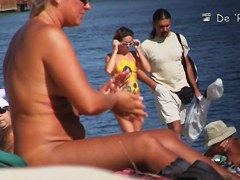 Voyeur webcam catches amateurs nude and half nude on beach