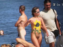 Voyeur webcam catches amateurs nude and half nude on beach